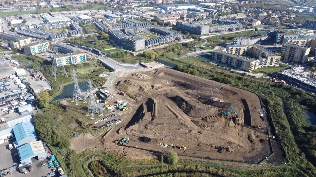 A reinforced soil retaining wall was needed to contain the raised construction platform